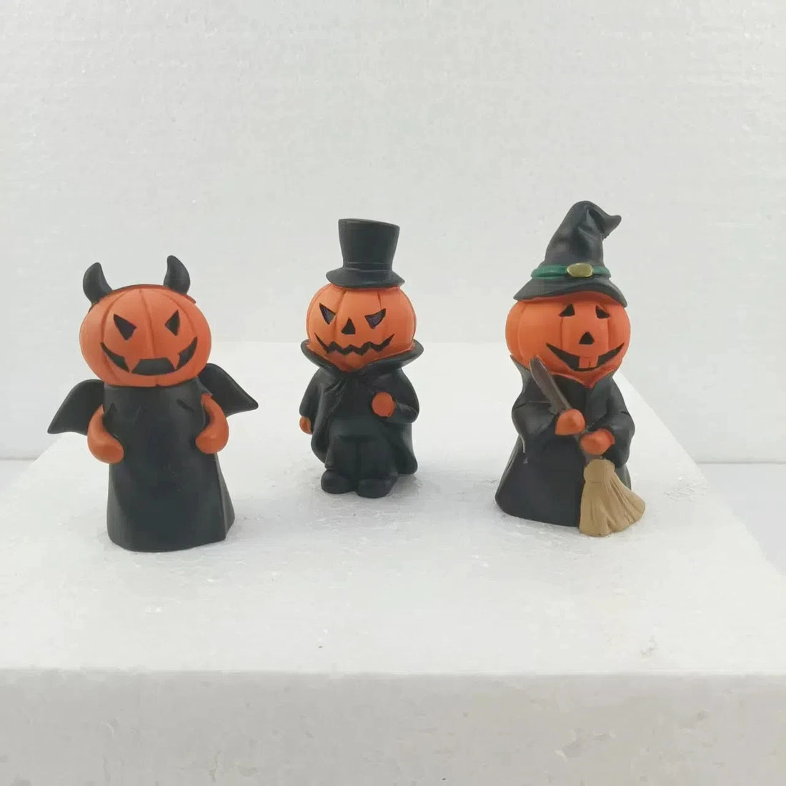 Three-piece set of Halloween decorative items featuring scary pumpkin dolls for haunted house party or table decoration, a fun a